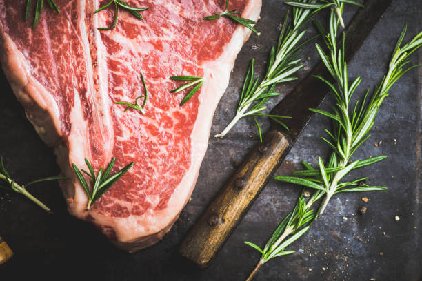 istock Raw fresh marble T-bone meat on the rustic background 1155128387