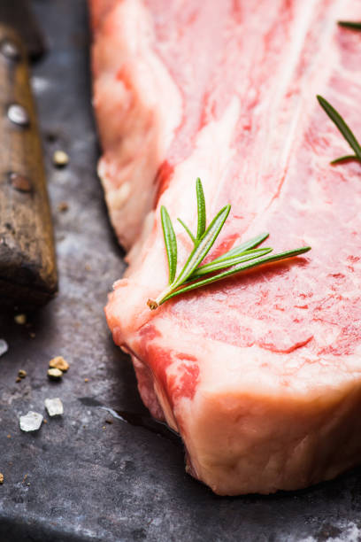 istock Raw fresh marble T-bone meat on the rustic background 1155128401