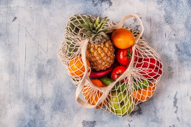 istock Fresh vegetables and fruits in bag mesh 1155130722