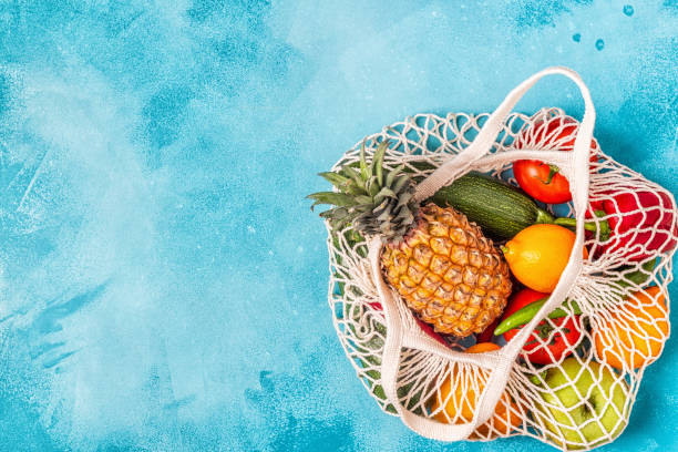 istock Fresh vegetables and fruits in bag mesh 1155130724