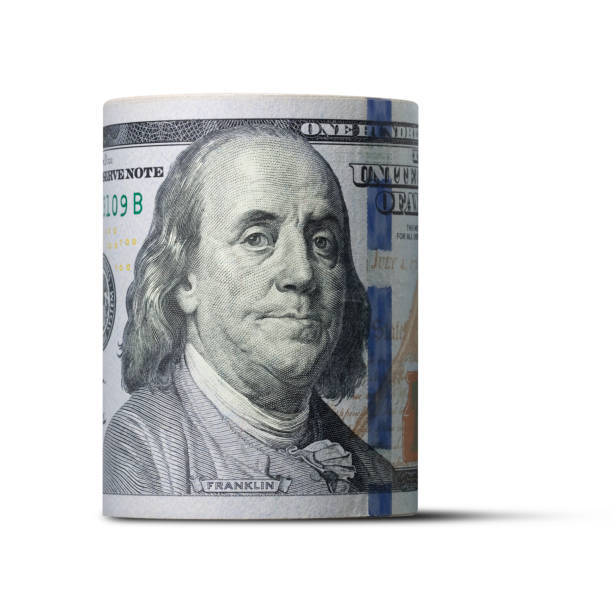 roll of dollar banknotes on white background - money roll fotos imagens e fotografias de stock