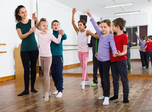 istock Children studying of partner dance  at dance school 1155136412