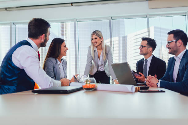 istock Group of young business people working together in creative office. 1155137790