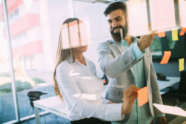 istock Business people planning strategy in office together 1155137791
