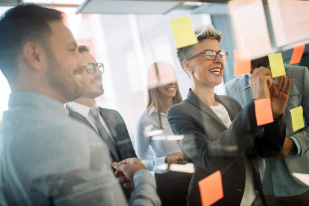 istock Business people planning strategy in office together 1155137801