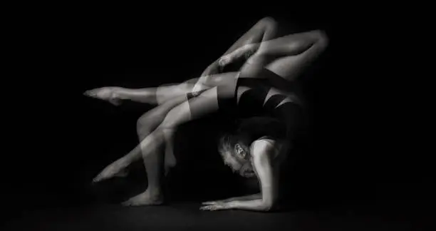 Photo of a studio shoot with multiple exposure black and white image with gymnastic posing