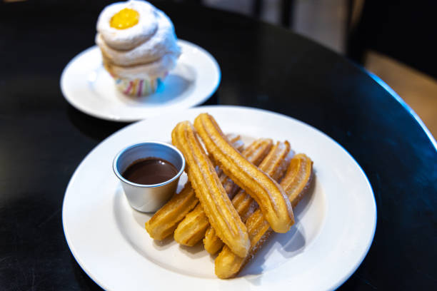 istock fried-dough pastry—predominantly choux—based snack churros with Chocolate Syrup 1155141034