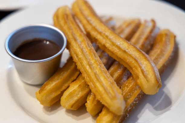 istock fried-dough pastry—predominantly choux—based snack churros with Chocolate Syrup 1155141064