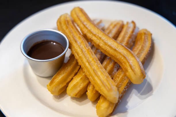 istock fried-dough pastry—predominantly choux—based snack churros with Chocolate Syrup 1155141111