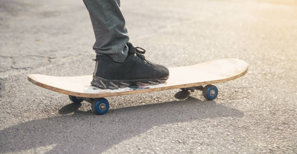 istock Boy rides on skateboard in the asphalt. 1155142746