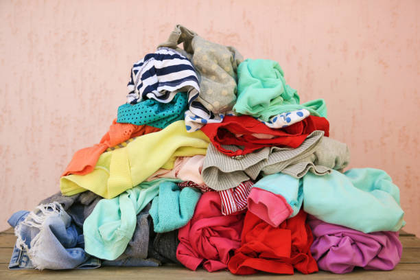 istock Pile of carelessly scattered clothes. 1155143498