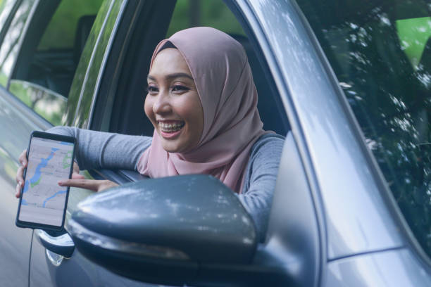 istock A young Muslim lady driver using navigation apps in Kuala Lumpur, Malaysia 1155143895