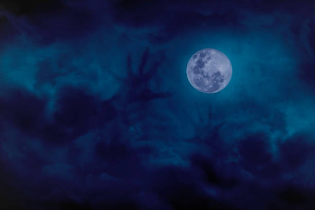 blue full moon with cloud demon on blue darkness sky, concept of horror - spirituality eyesight space abstract imagens e fotografias de stock