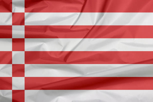 istock Fabric flag of Bremen, a red and white flag. 1155145857