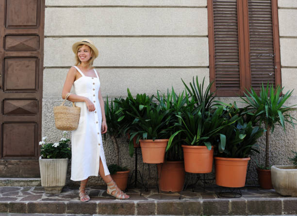 pretty girl in a sundress pretty girl in a sundress on italian street sundress stock pictures, royalty-free photos & images