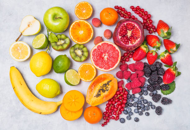 istock Fruits and berries rainbow top view. 1155153332