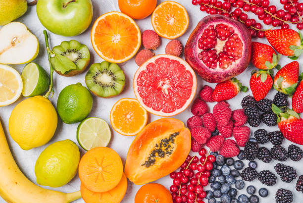 istock Fruits and berries rainbow top view. 1155153381