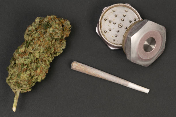 istock Closeup of weed joint and grinder 1155153424