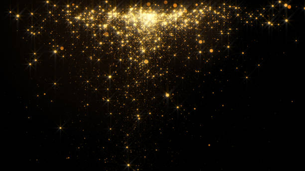 istock Gold glittering sequins for beauty product on dark background 1155156216