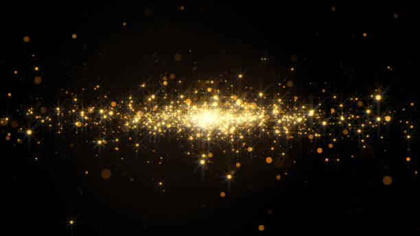 Abstract background with golden light bokeh particles in motion. stock photo