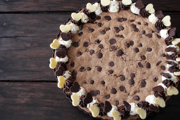 istock Chocolate chip cookie cake on wooden background 1155158067