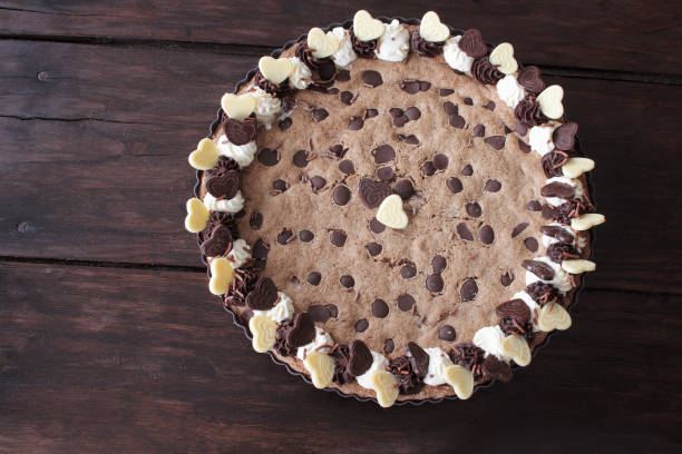 istock Chocolate chip cookie cake on wooden background 1155158140