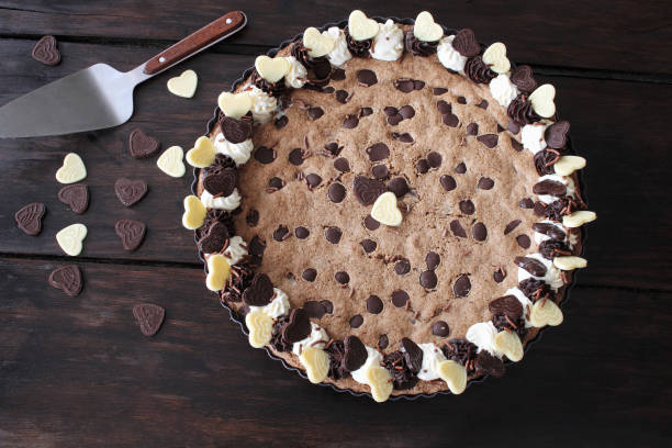 istock Chocolate chip cookie cake on wooden background 1155159055