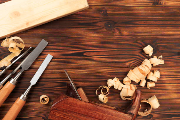 istock chisels plane and sawdust on a wooden table - Image 1155160411