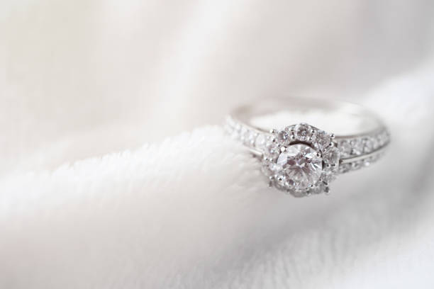 istock luxury jewelry diamond ring on white fur texture 1155161169