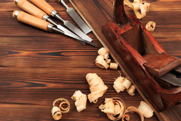 istock chisels plane and sawdust on a wooden table - Image 1155161732