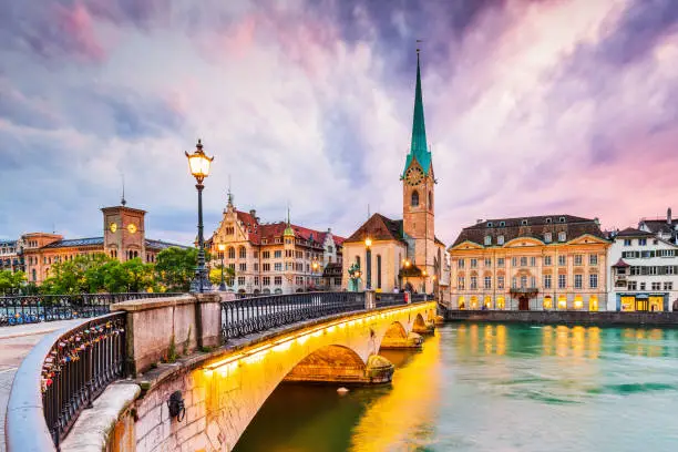 Zurich, Switzerland. View of the historic city center with famous Fraumunster Church, on the Limmat river.