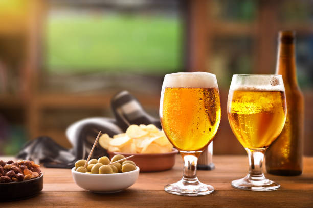 istock Appetizer table and tv background to watch match with friends 1155163439