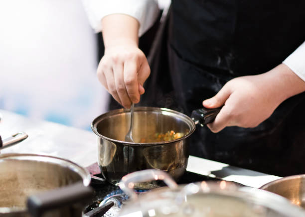 istock Chef cooking food in the kitchen, Chef preparing food 1155163748