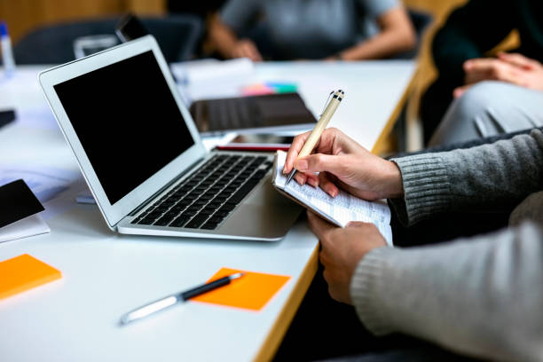 istock Jotting down important point of meeting 1155163815