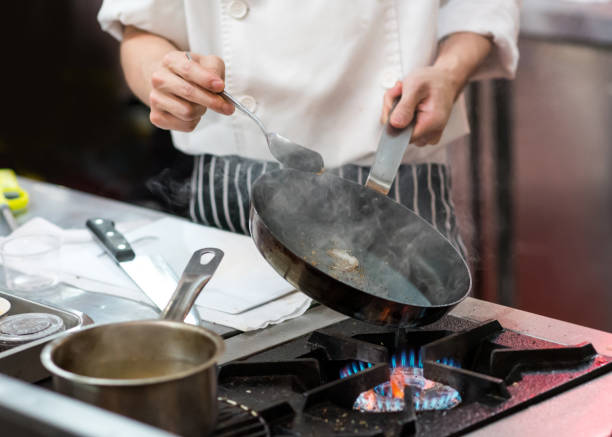 istock Chef cooking food in the kitchen, Chef preparing food 1155163827