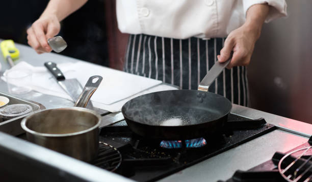 istock Chef cooking food in the kitchen, Chef preparing food 1155163833