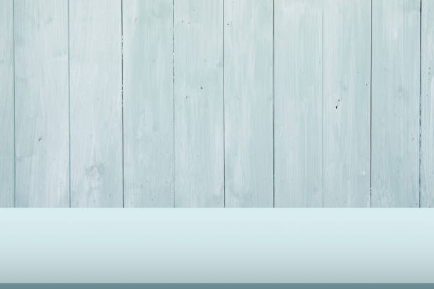 istock Light green wooden table with wood wall background. 1155164065