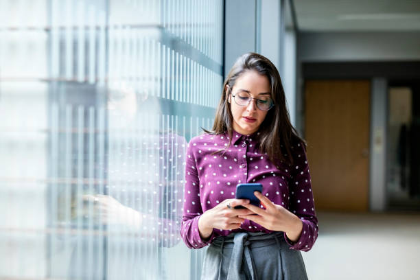 istock Businesswoman using cell phone 1155164109