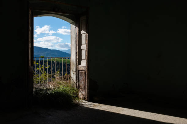 istock Opened window. A glimpse of ghost town Alianello. 1155167754