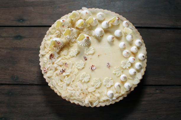 istock White chocolate tart on woden background 1155170106