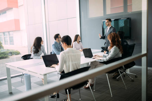 istock Group of architects and business people working together 1155171345