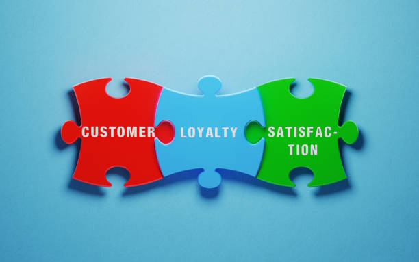 istock Customer Satisfaction Concept - Colorful Jigsaw Puzzle Pieces On Blue Background 1155172424