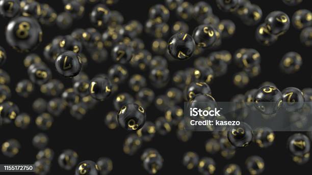 Carbon Fiber Lottery Balls With Golden Numbers 3d Illustration Stock Photo - Download Image Now