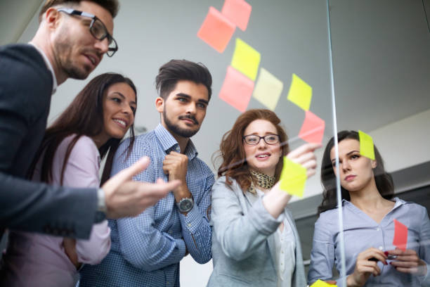 istock Group of architects and business people working together 1155173046