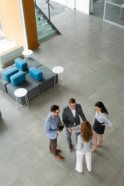 istock Group of architects and business people working together 1155173143