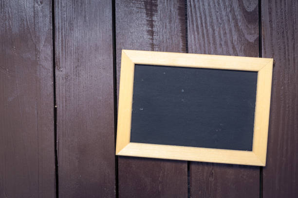 istock Small blackboard on old wood background 1155174489