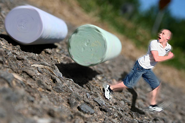 Run!!!! When your only 1 inch tall, everything is out to get you! Even chalk set rolling down the street by some careless kids. A surreal scene of a little person (Tom Thumb) running away from normal sized chalk.