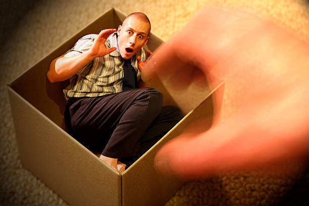 istock Little Man Trapped in a Box 115517938