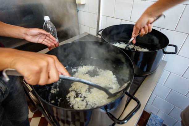 istock Stirring onions while frying in a pot 1155179395