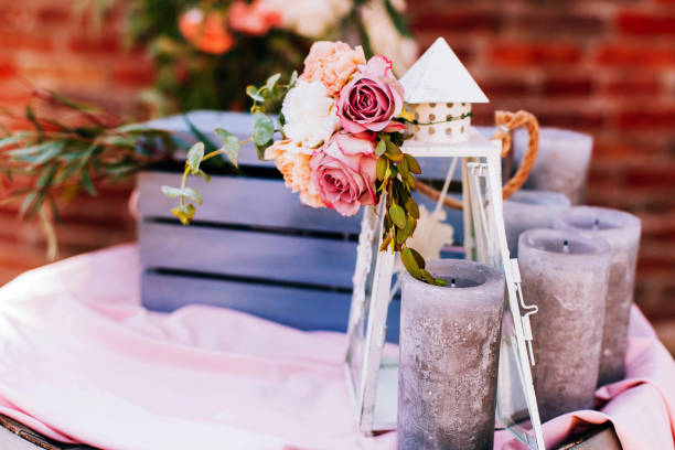 istock White lantern and black candles stand before blue wooden box 1155179482